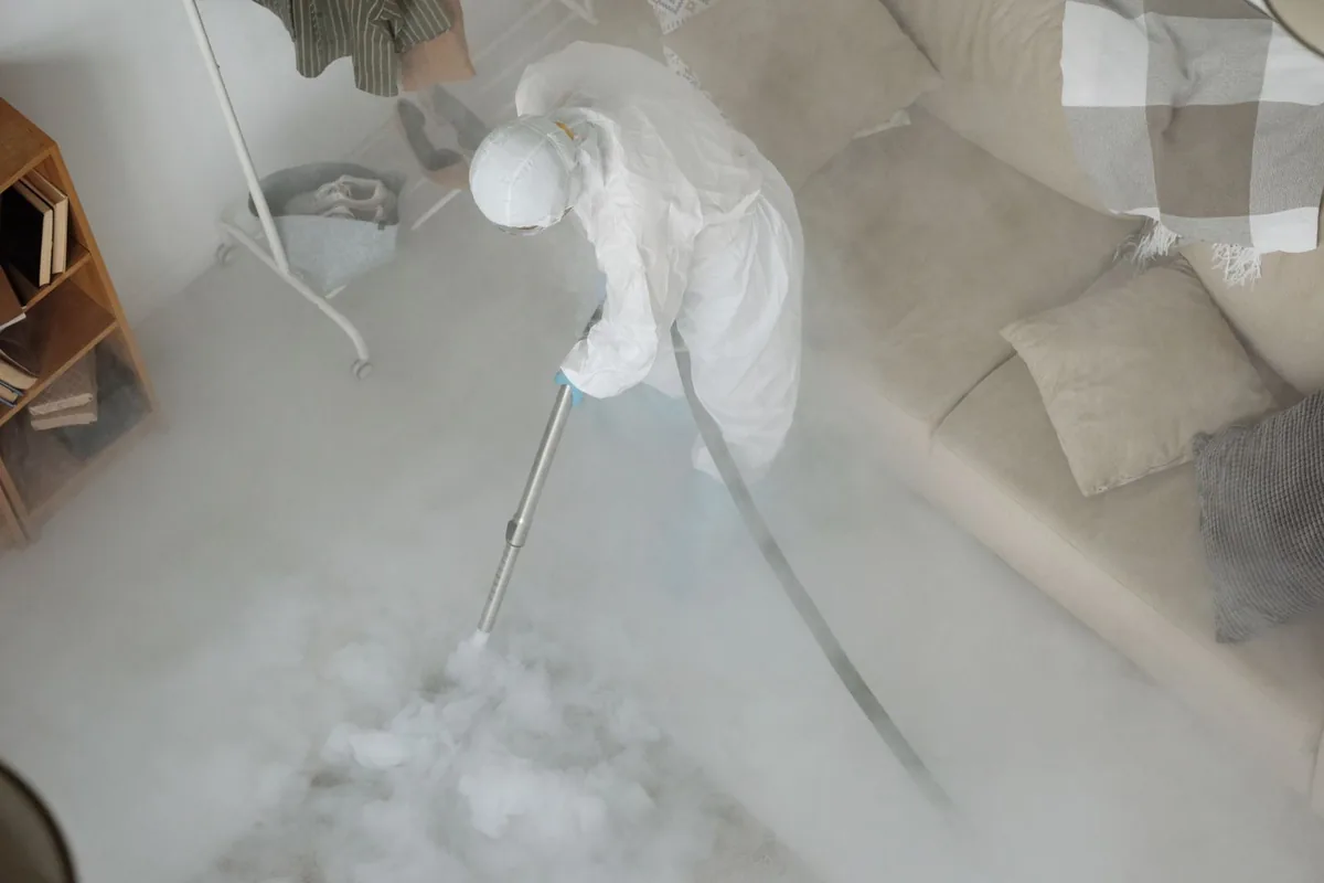 Biohazard cleanup technician in protective equipment, Willard / Hay, Minneapolis, MN